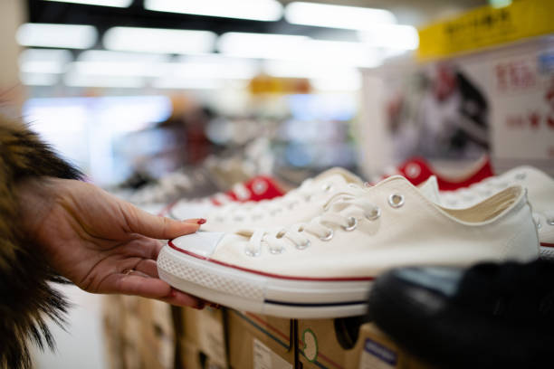 istock Woman's hand choosing shoes 1457109819