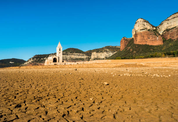Swamp of SAU in "Vilanova de Sau", Barcelona, Catalonia, Spain. The swamp in period of drought. Normally, it is impossible to see the church. reservoir stock pictures, royalty-free photos & images