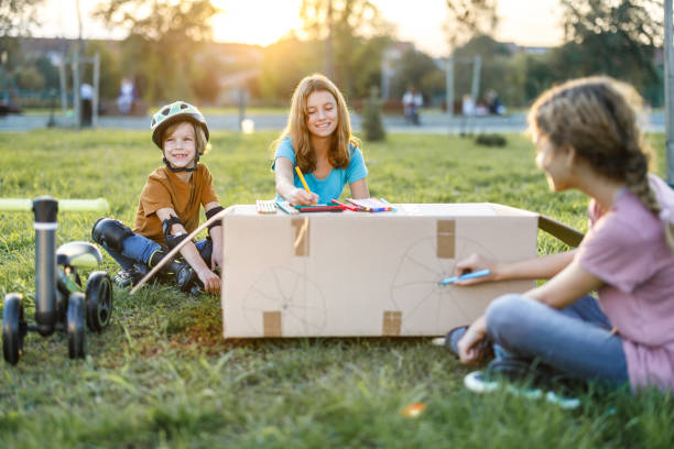 istock Playful kids having fun in the park 1457114908