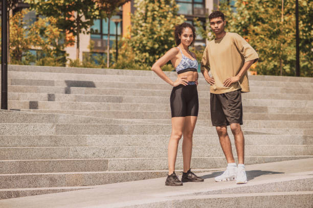 istock Sporty couple posing for the camera outside 1457115003