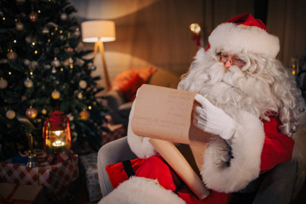 istock Santa Claus reading wishes 1457116252