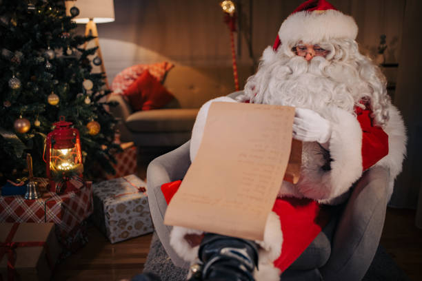 istock Santa Claus reading wishes 1457116372