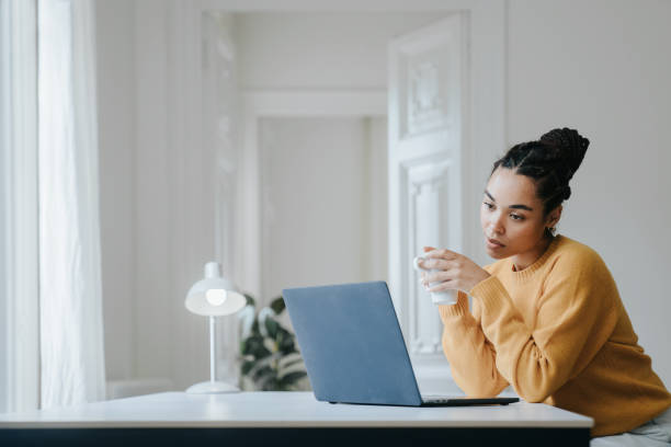 istock Young woman working at home 1457116396