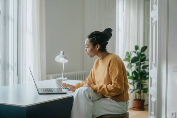 istock Young woman working at home 1457116450