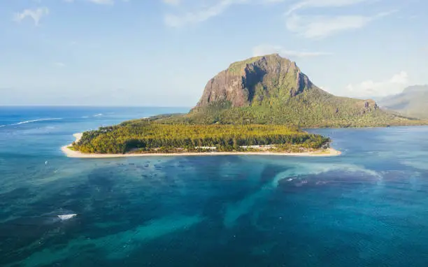 "Underwater Waterfall" famous landmark on Mauritius island near Le Morne peninsula with basalt mount. Also a wonderful kiteboarding and windsurfing spot. Exotic traveling aerial photo concept.