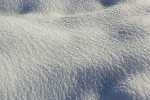 background of fresh snow texture in blue tone.