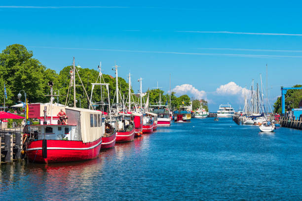 istock Fishing boats in spring time in Warnemuende, Germany 1457118431