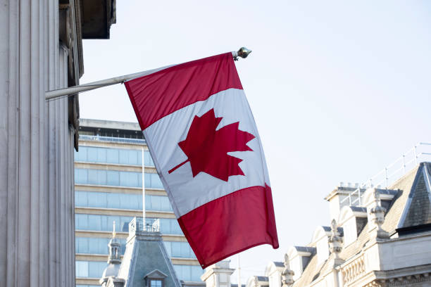 istock Canada flag hanging outside a building in London 1457121698