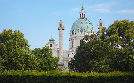 The facade of Karlskirche with its twin towers and dome in Vienna, Austria