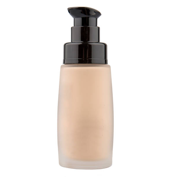Foundation cosmetic glass jar with tinted moisturizer isolated on white