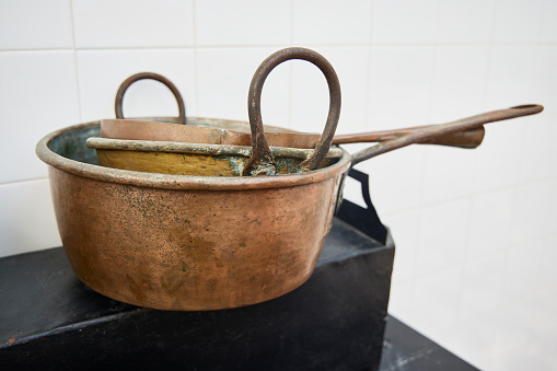 Old kitchen pots on a shelf