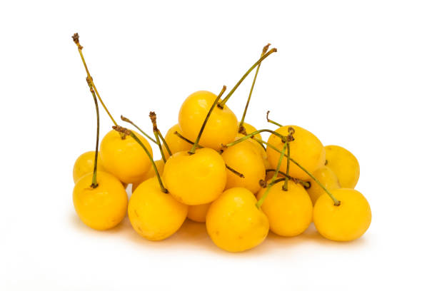 Yellow cherries on isolated white background