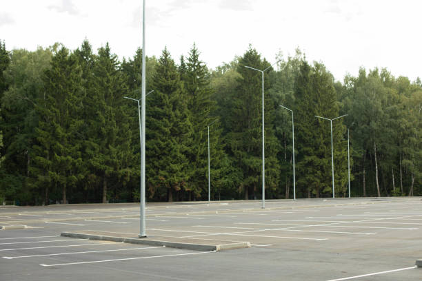 istock Empty parking in summer. Parking in park. Parking place. 1457129636