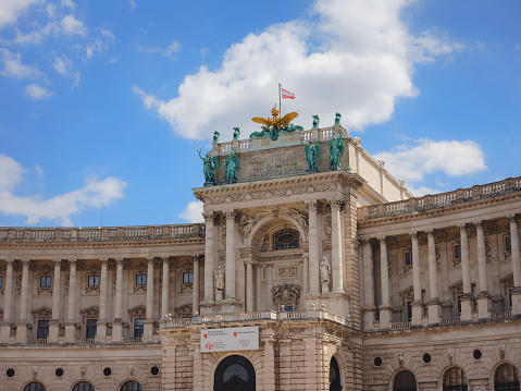 Vienna, Austria - August 10, 2022: The Hofburg in the imperial palace on Heldenplatz in the center of Vienna. Outside facade of historic and famous building. Concept for heritage building