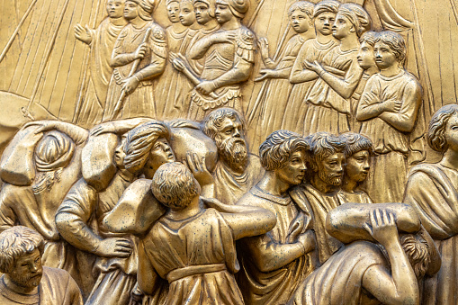 This international landmark, as seen on the external public-facing door of the baptistery, was designed by Lorenzo Ghiberti (between 1425-1452) and is an icon of the renaissance. The reliefs represent stories from the Old Testament. The visible heads are those of prophets. The doors displayed are now a copy of the original, with those being displayed in a local museum.