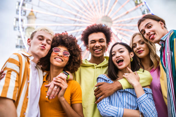 istock Group of multiethnics young friends having fun together 1457135486