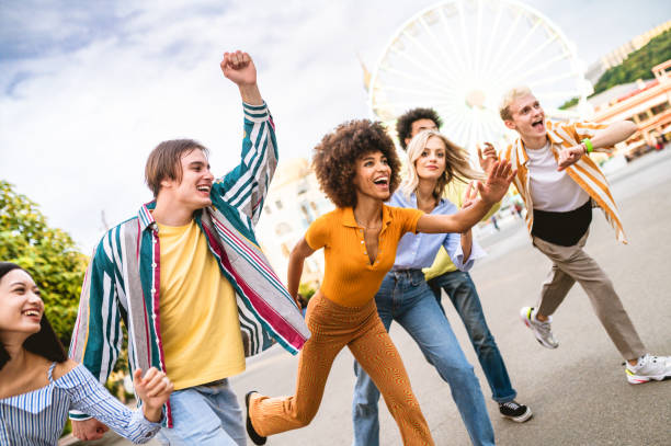 istock Group of multiethnics young friends having fun together 1457135982