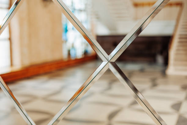 luxury mirror wall with crystals, decoration and reflection. Abstract glass background. Hotel or apartment interior. Polygonal surface. Close-up. Texture