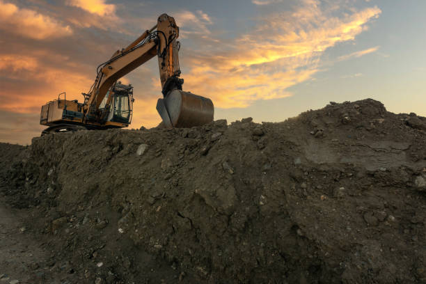 istock Excavator building a road in a site construction 1457139481