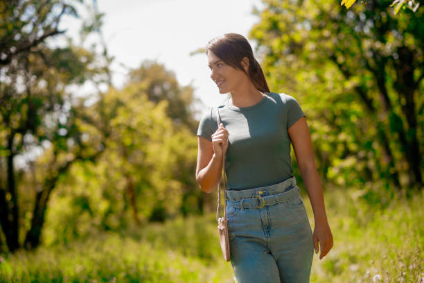 istock Pretty woman walking and enjoying nature 1457139636