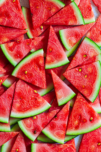 red macro watermelon background,Red watermelon triangular piece on white blackground,Backgrounds,Close-up,Extreme Close-Up,Food,Food and Drink,Freshness,Fruit,