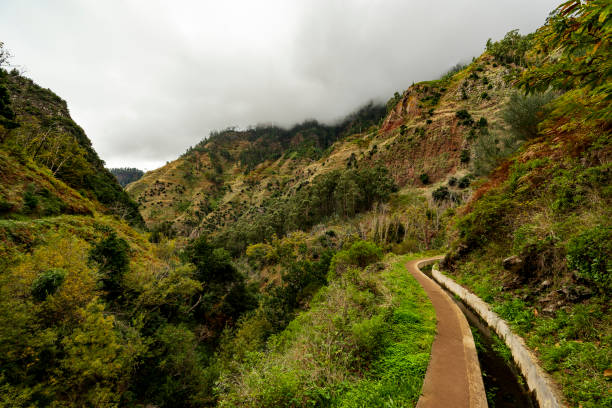 Cloudy sky over the hiking trail of Levada Nova, leading through the valley of Ponta do Sol, Madeira, Portugal