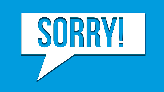 Sorry message to express regret, remorse, apology for error, mistake, guilt and request forgiveness. Concept with word written in cut out paper in shape of speech bubble with blue background