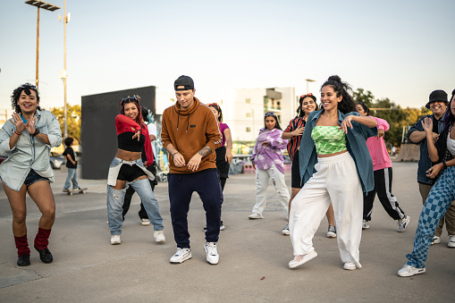 Performance group dancing at skateboard park