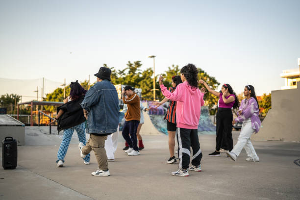 istock Performance group dancing reggaeton at skateboard park 1457145805