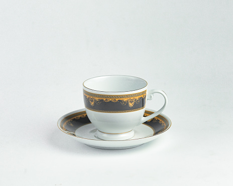 White cup and saucer on a white background
