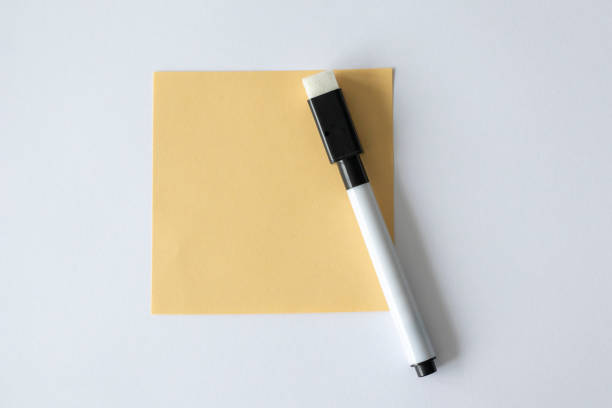 istock A note pad for writing on a white background next to the felt-tip pen. 1457147862