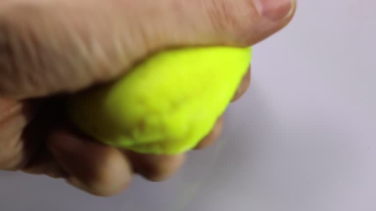 hand of a patient with the plasticine during the rehabilitation