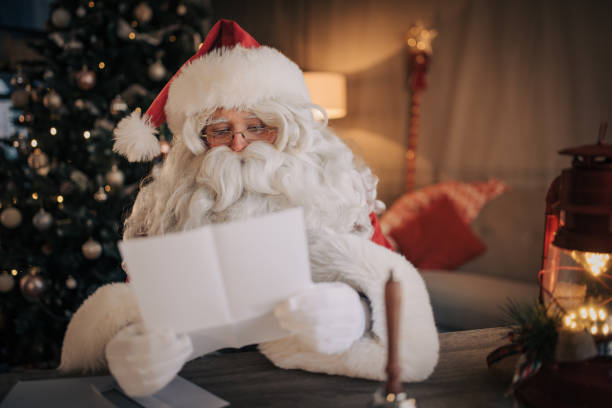 istock Santa Claus reading a letter 1457148909