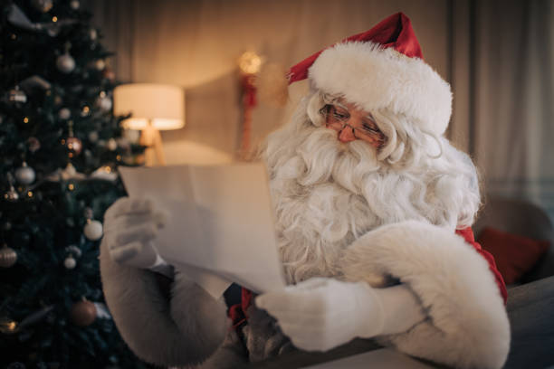 istock Santa Claus reading a letter 1457149040