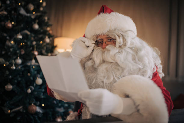 istock Santa Claus reading a letter 1457149054