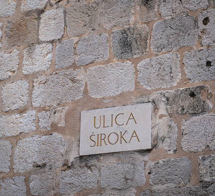 Ulica Siroka (translation; Broad Street) name sign in the Old City of Dubrovnik, Croatia