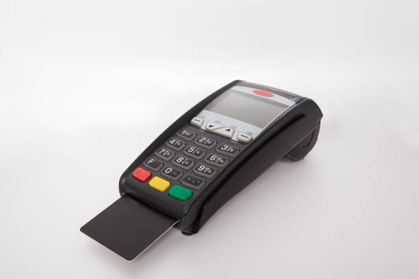 istock Credit card reader pos device on white background.Customer making wireless or contactless payment using credit card. 1457150705