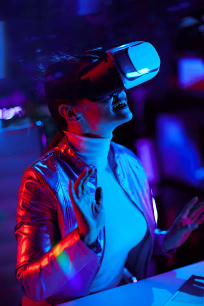 istock smiling stylish woman exploring metaverse in modern office 1457150938