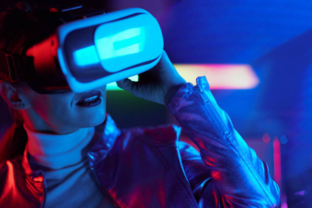 istock modern woman in virtual reality goggles on dark background 1457150977