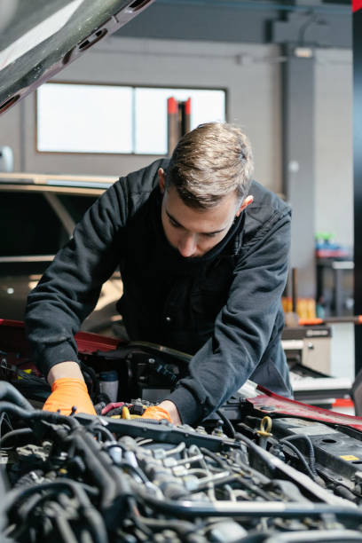 istock Car mechanic working in a garage 1457152194