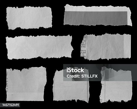 istock Torn papers on black 1457152491