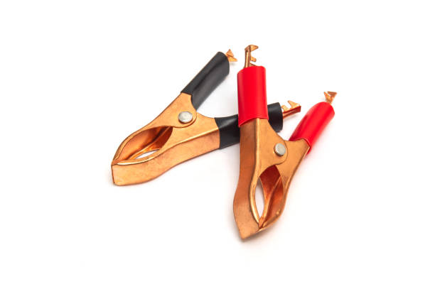 istock Copper battery clamps black and red for wires on white background 1457154535