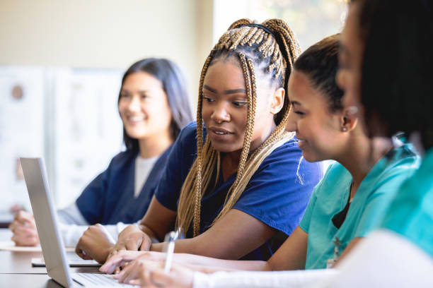 Diverse group of women are nursing or medical students at local university Diverse group of women are nursing or medical students at local university mature student stock pictures, royalty-free photos & images