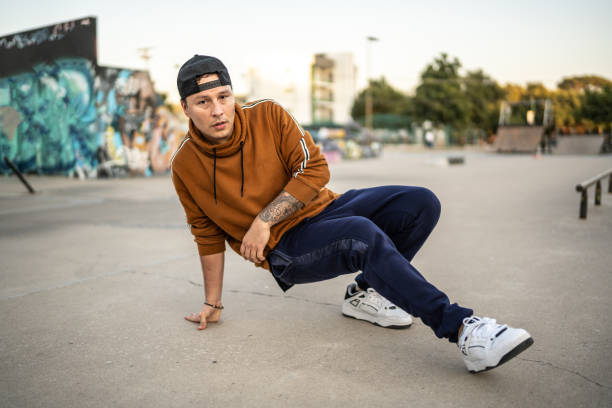 istock Portrait of young man breakdancing at skateboard park 1457161049