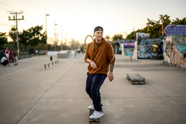 istock Young man skateboarding at skateboard park 1457161125