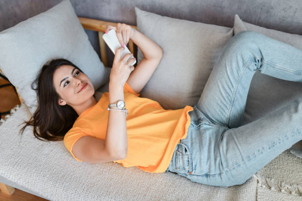 istock Cute Female Texting On Smartphone 1457166238