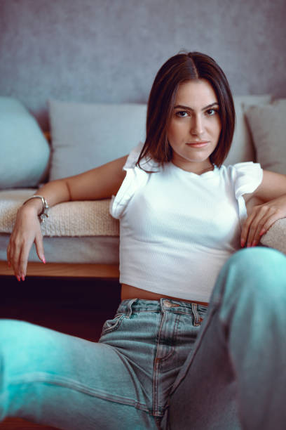 istock Confidence Showed By Beautiful Female Sitting On Floor 1457166658