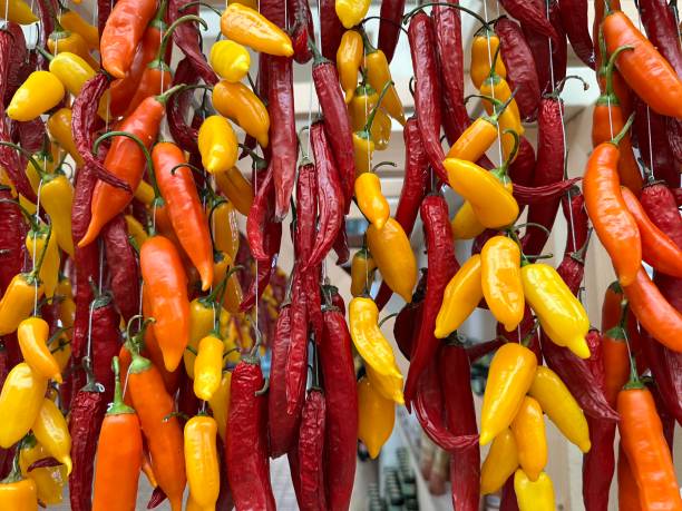 Fresh chilli peppers Fresh chilli peppers at Funchal Market, Madeira Island madeira sauce stock pictures, royalty-free photos & images