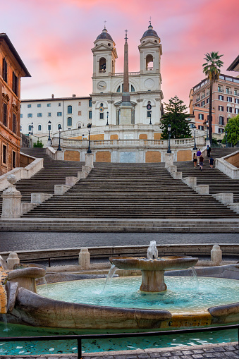 Fountain of Boat and Spanish steps with Trinita dei Monti church in Rome, Italy