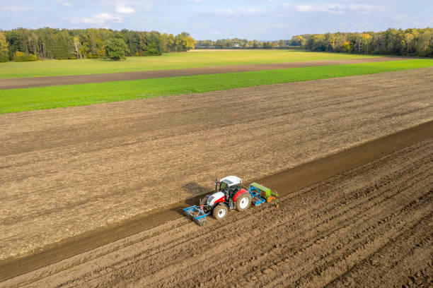 istock Tractor Working on Field, Aerial View 1457169762